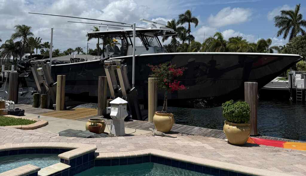 Elevator boat lift by pool icw.