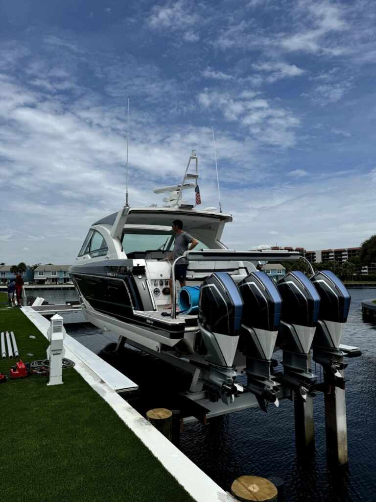 4 post boat lift with a quad engine boat in highland beach.