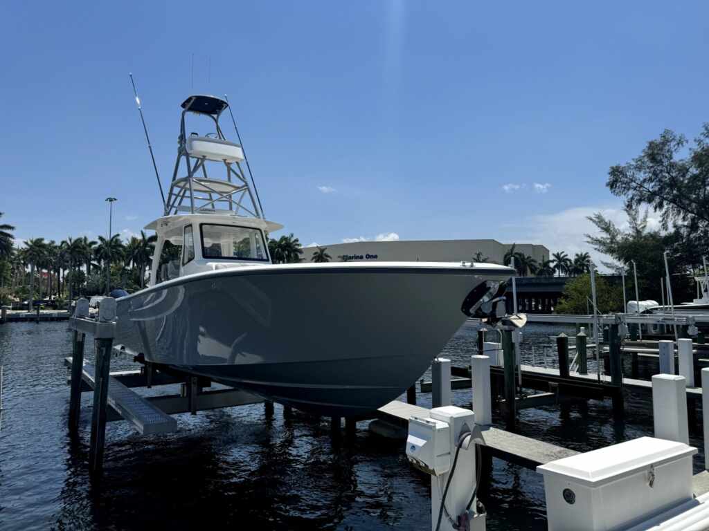4 post boat lift with a tower boat in boca raton.