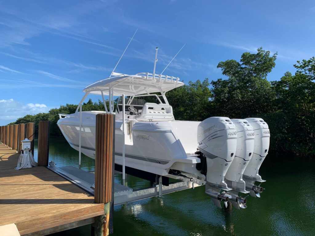 4 post boat lift with a triple engine center console.