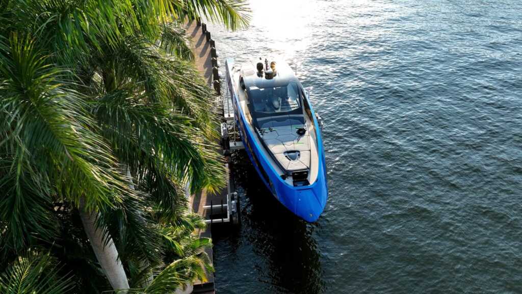 8 post boat lift with a lamborghini yacht in fort lauderdale aerial.