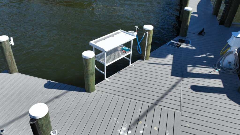 Composite dock with a fish cleaning station in tequesta.