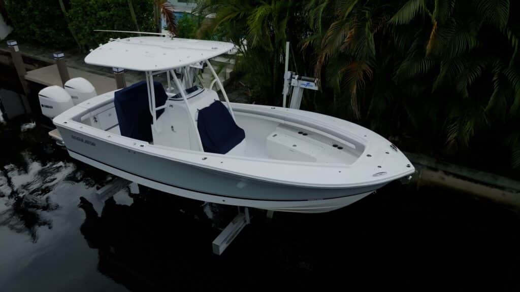 White center console raised on an elevator boat lift.