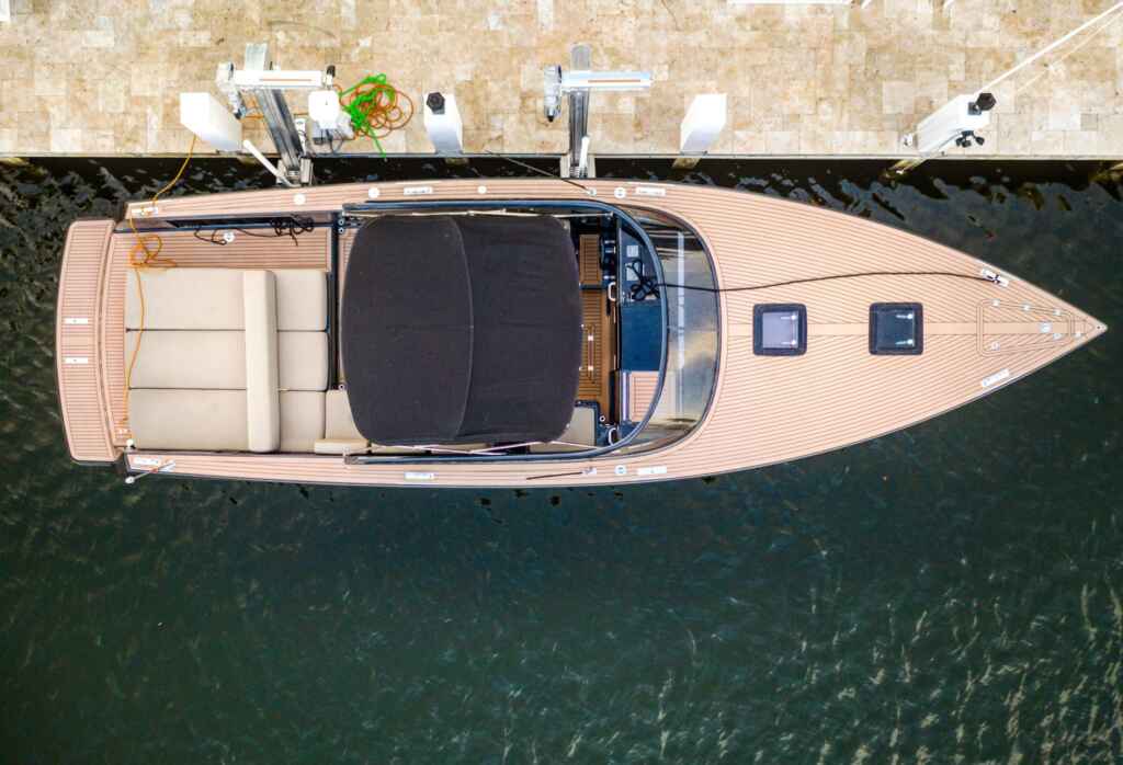 Elevator boat lift with a classic runabout overhead.