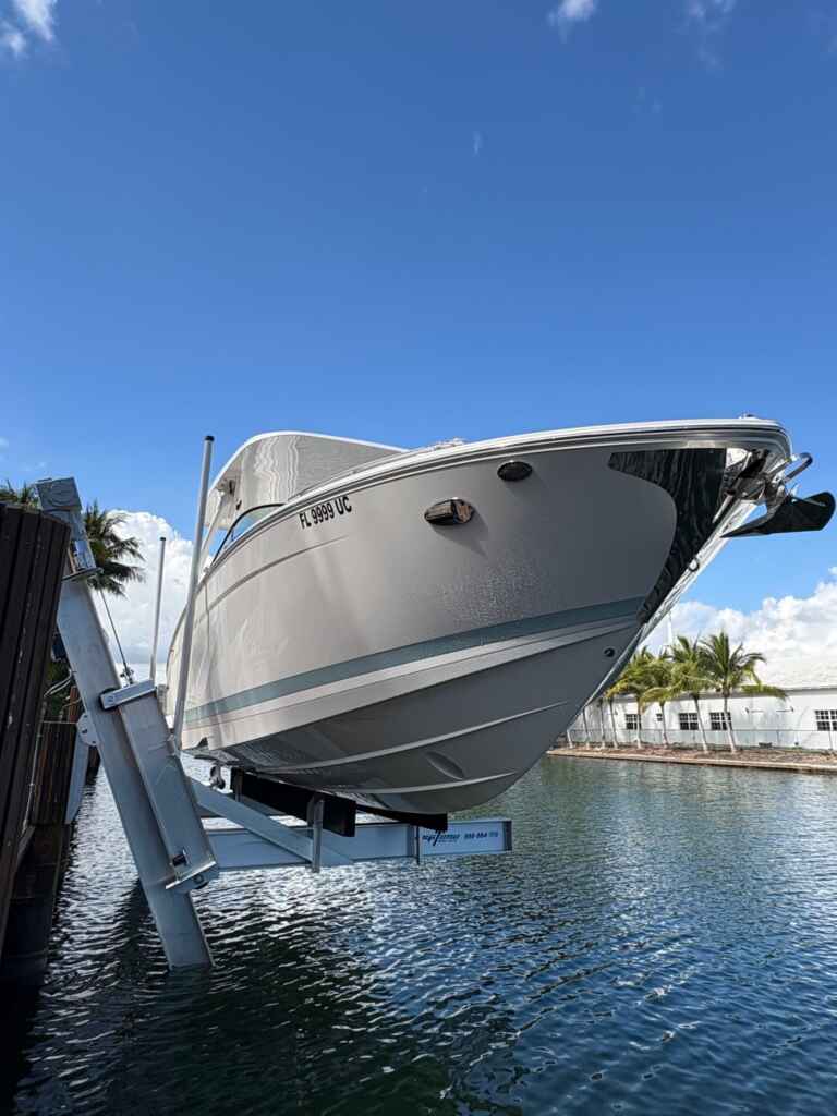 Elevator boat lift with a cruiser on a canal.