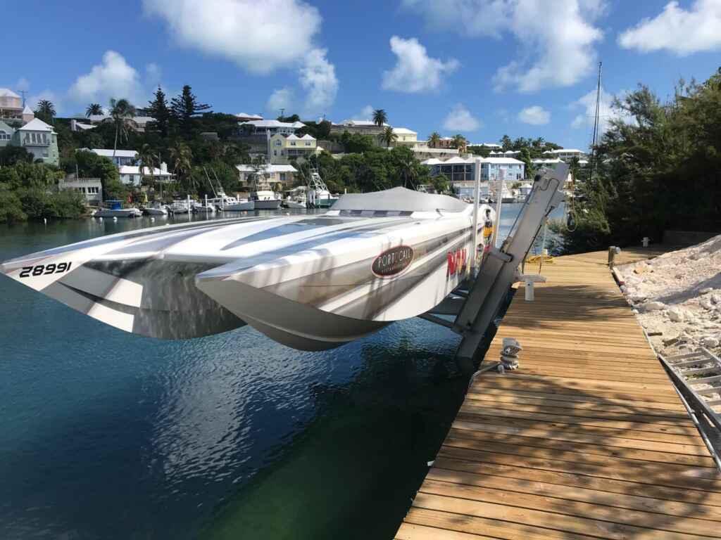 Elevator boat lift with a performance boat.