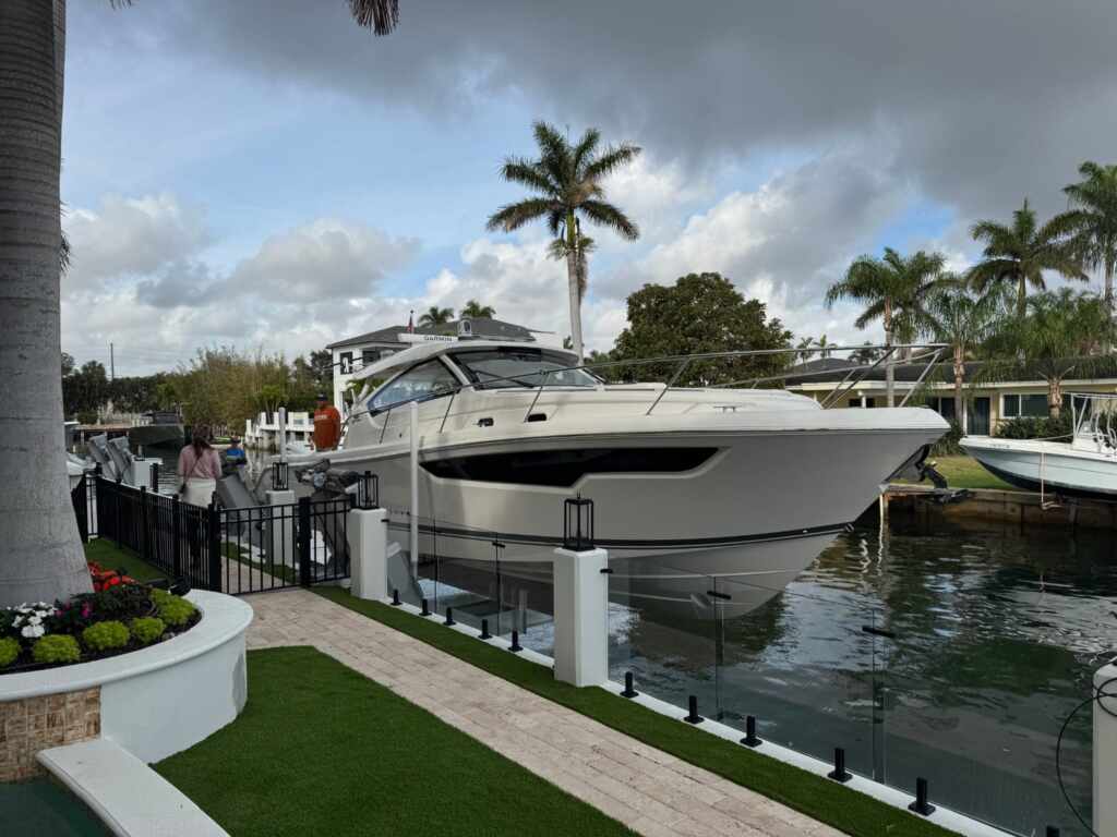 Elevator boat lift with an express cruiser in boca raton.